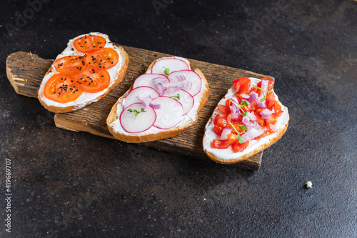 vegetable bruschetta tomato, radish cream cheese on the table cooking meal snack top view copy space food background rustic image 