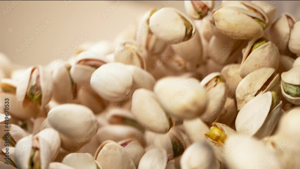 Super slow motion of flying pistachios in rotating movement. Filmed on high speed cinema camera, 1000fps.