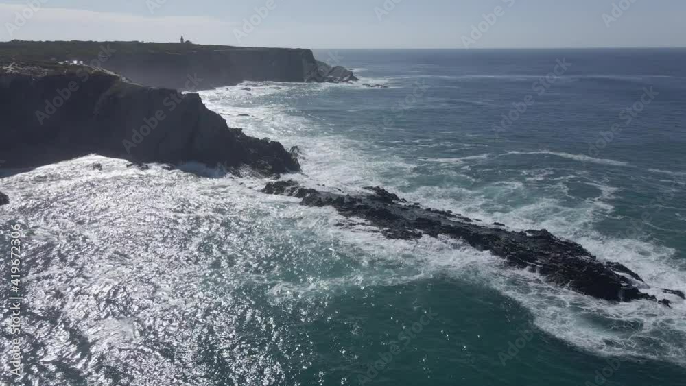 Aerial view of black cliffs in strong waves in Algarve, Portugal 4 Aerial view of black cliffs in strong waves in Algarve, Portugal 4