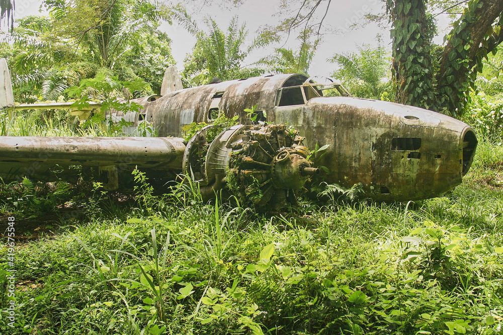 wreck of american bomber crashed in jungle vegetation during world war II wreck of american bomber crashed in jungle vegetation during world war II