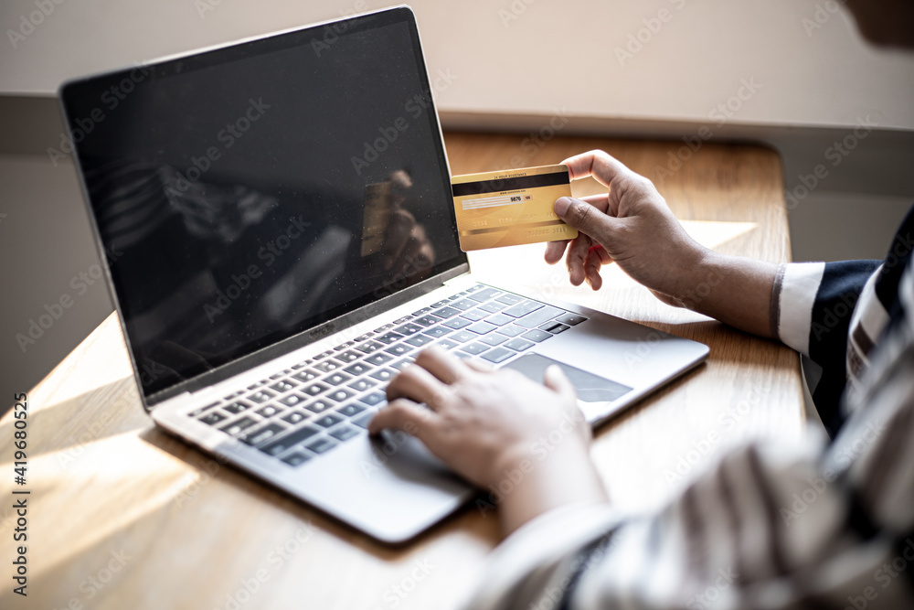 Women are filling out their credit card information to pay for purchases made through the website. Credit cards can pay for goods and services online. Online shopping ideas Women are filling out their credit card information to pay for purchases made through the website. Credit cards can pay for goods and services online. Online shopping ideas