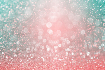Fancy teal green confetti, coral pink glitter and pastel colors sparkle turquoise background for Spring or Christmas