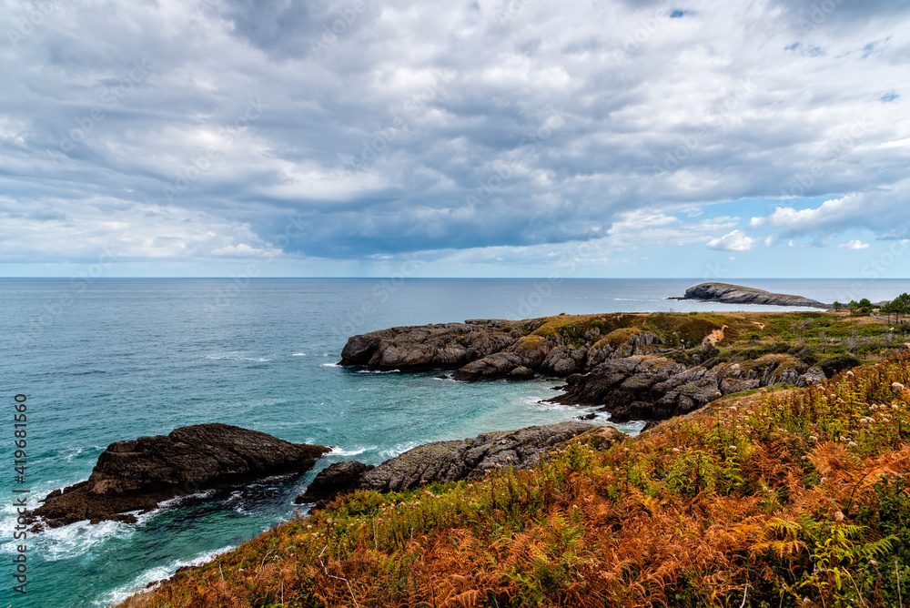 Scenic view of rocky seascape, cloudy day of summer. The Whale of Orinon, Sonabia, Cantabria, Spain