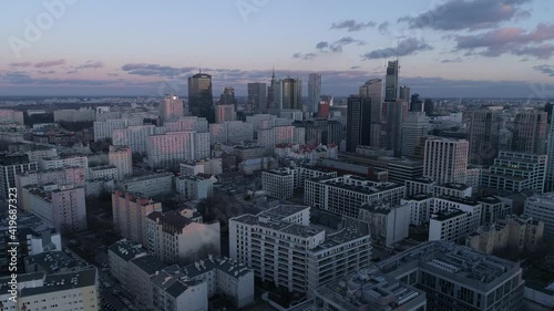 Skyline of a big city. High skyscrapers and busy streets at sunset in the background.