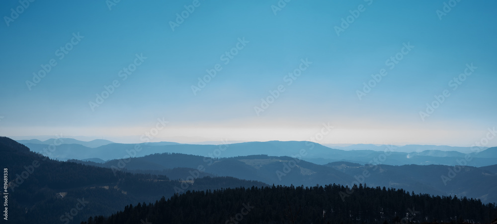 Amazing panorama background banner long from a fog landscape in the morning in black forest	
