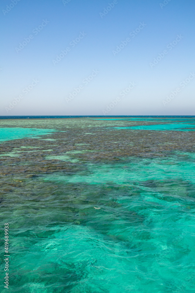 Red sea coral reef and blue sky. El Gouna, Egypt Red sea coral reef and blue sky. El Gouna, Egypt