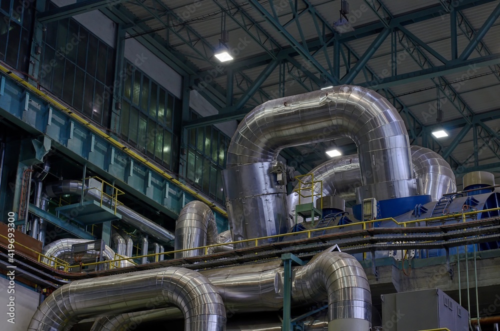 High pressure steam lines on a steam turbine. High pressure steam lines on a steam turbine.