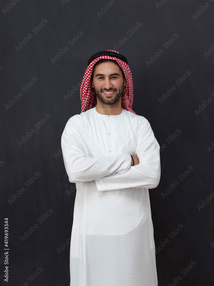 Portrait of young muslim man wearing traditional clothes Portrait of young muslim man wearing traditional clothes