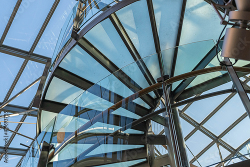 Glass, spiral staircase, a fragment of modern architecture