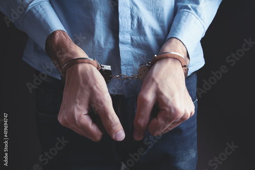 Papier peint men handcuffed in criminal concept