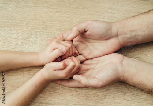 Fotografía children and adults hands on a light background close-up