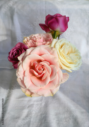 Delicate small bouquet of beautiful colorful roses