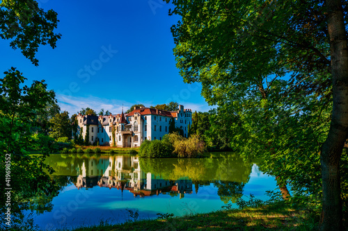 Güttmannsdorf Castle, a neo-Gothic castle on a small lake in Dobrocin, Poland. © Bernhard