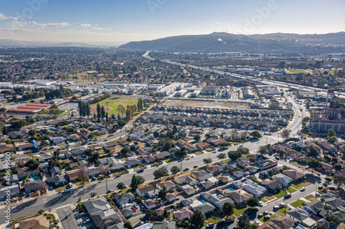 Drone Aerial View Suburban Coastal California Neighborhood. Single Family Homes Near A Park and Ocean photo