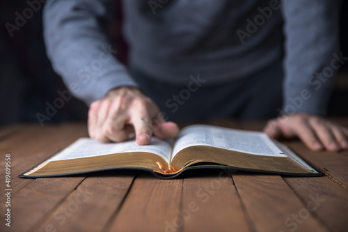man reading Holy Bible