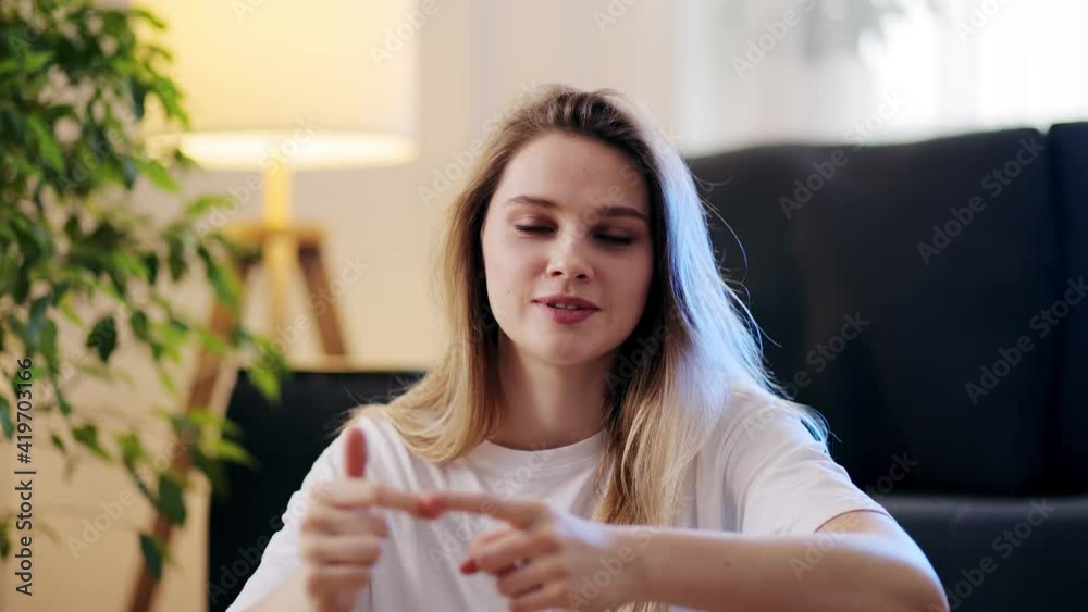 Happy young blonde woman talks to web camera making distance online video conference call. Webcamera view. Telework concept Happy young blonde woman talks to web camera making distance online video conference call. Webcamera view. Telework concept