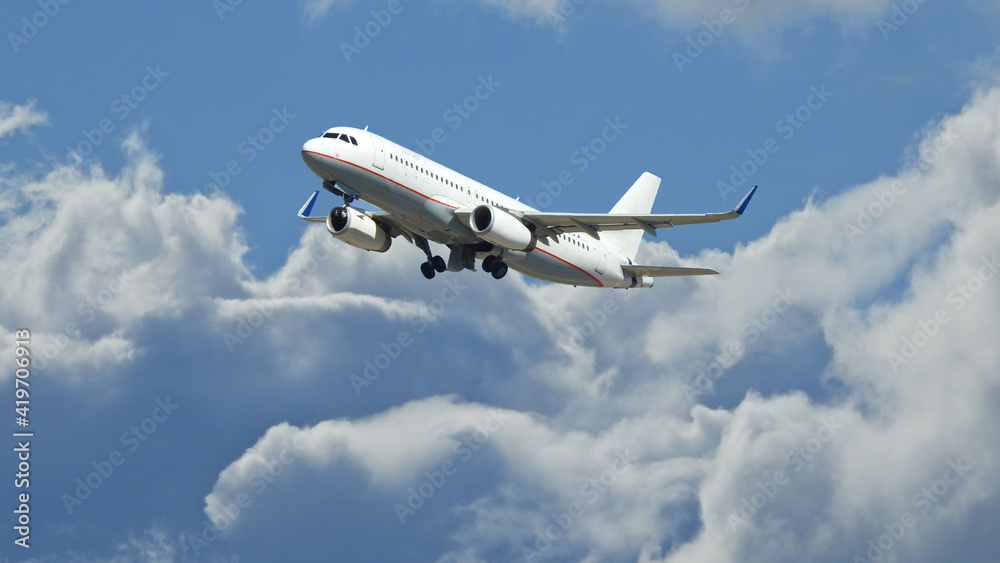 Zoom photo of passenger airplane flying above clouds in deep blue sky Zoom photo of passenger airplane flying above clouds in deep blue sky