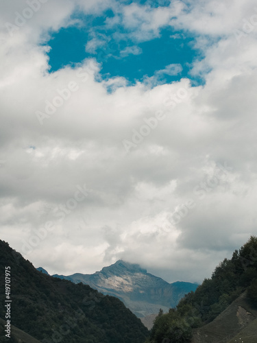 Huge mountains in Georgia, gudamakari valley in summertime. Beautiful sunny landscape with huge mountains, freedom in tourism concept 