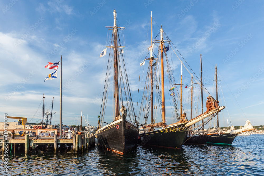 USA, Massachusetts, Cape Ann, Gloucester. Gloucester Schooner Festival, schooners at dusk