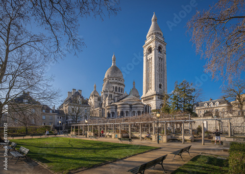 Paris, France - 02 26 2021: Montmartre district. View of the Basilica of sacred heart from Square Marcel Bleustein Blanchet photo