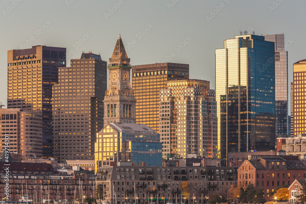 USA, Massachusetts, Boston. City skyline from Boston Harbor at dawn.