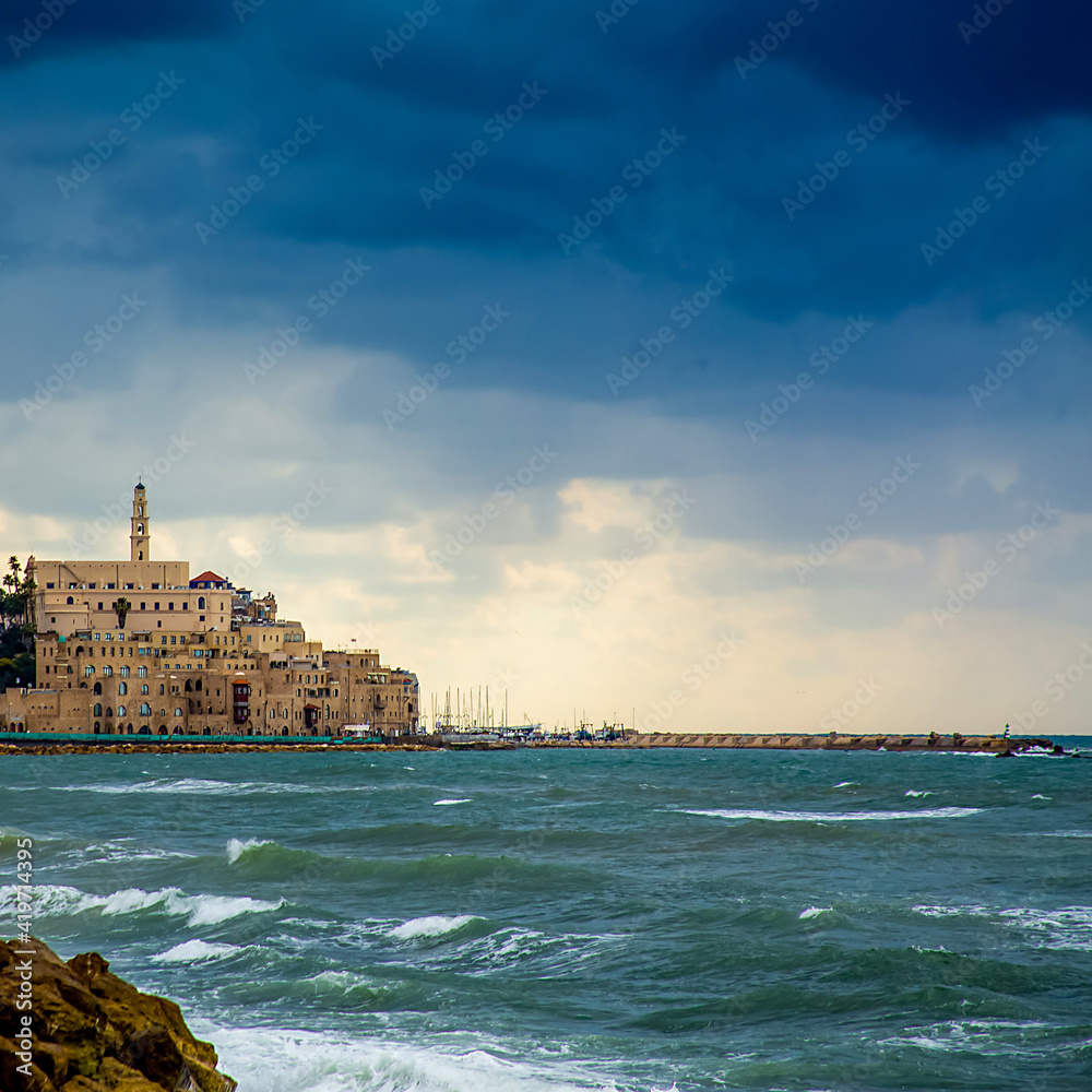 Tel Aviv, Israel - March 04, 2021: view of the old city of Jaffa in inclement weather, dark clouds above it