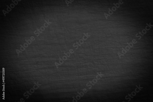 Fabric or canvas. A piece of crumpled fabric of dark gray color. Material for sewing clothes