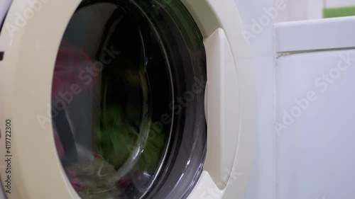 Wallpaper Mural Washing Colored Clothes in Household Washing Machine. Rotating Drum. Zoom Torontodigital.ca