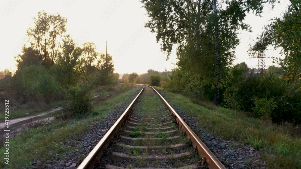 Railway at sunset. Drone flight over the railroad track. Railway at sunset. Drone flight over the railroad track.