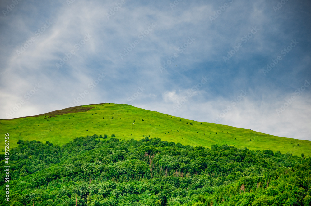 Fototapeta premium the mountain green valley with blue sky