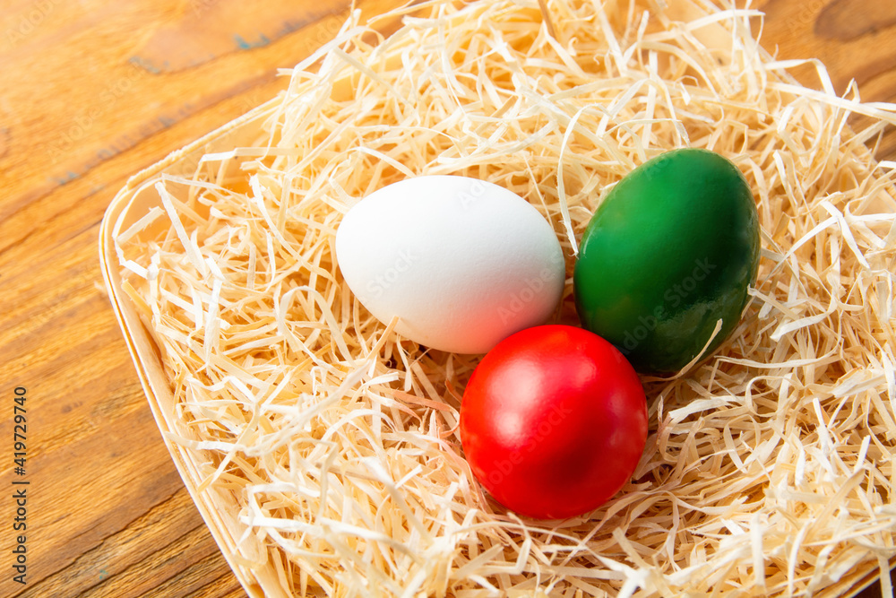 Easter eggs as the color of the Italian flag - green, white, red. Happy Easter holiday card Easter eggs as the color of the Italian flag - green, white, red. Happy Easter holiday card