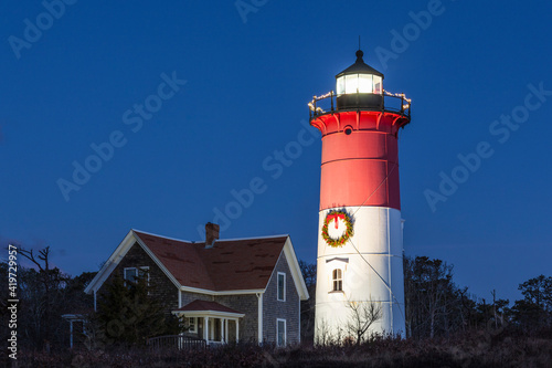 USA  Massachusetts  Cape Cod  Eastham. Nauset Light with Christmas wreath at dawn.