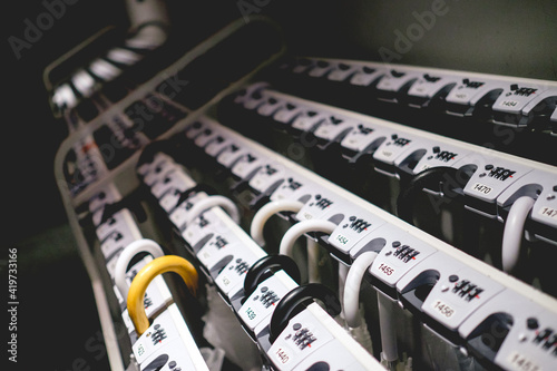 Wallpaper Mural Umbrella holder with key and numbers with some umbrellas, Japan Torontodigital.ca