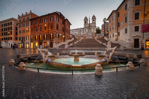 Italy, Rome, Spanish Steps, Piazza di Spagna, Barcaccia Fountain, Fountain on town square at dawn