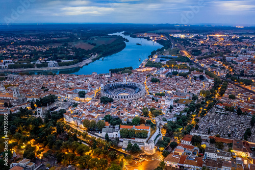 France, Provence-Alpes-Cote dAzur, Arles, Aerial view of Arles Amphitheatre and surrounding buildings at dusk