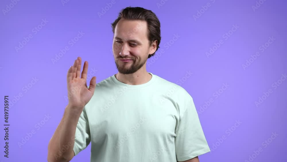 Young man showing gesture of nonsense, not serious. You're kidding, no way. Guy reaction to pleasant compliment over violet background. Young man showing gesture of nonsense, not serious. You're kidding, no way. Guy reaction to pleasant compliment over violet background.