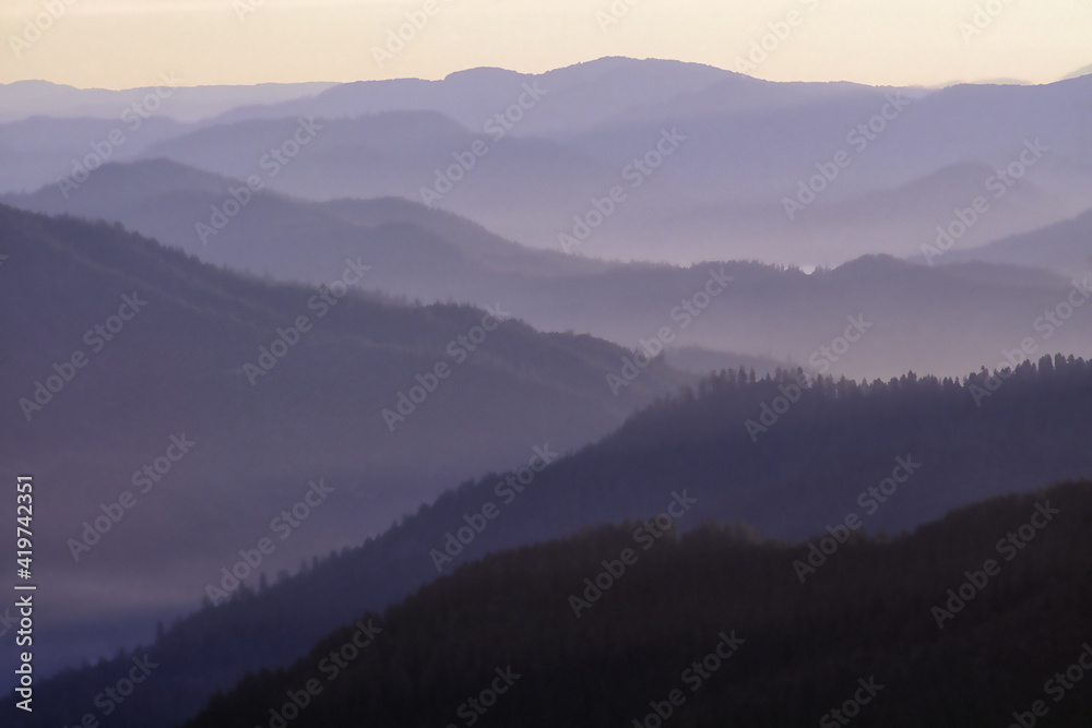 Rogue River valley in early morning with fog and mist in the valley. Oregon. Photographed on Fujichrome film with Nikon F4 35-mm camera. Rogue River valley in early morning with fog and mist in the valley. Oregon. Photographed on Fujichrome film with Nikon F4 35-mm camera.