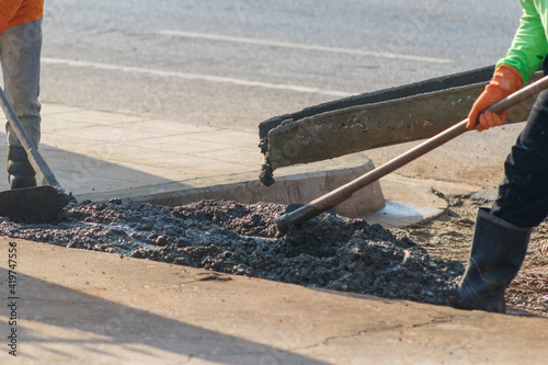 concrete casting work. using a concrete pump machine to fill the floor concrete with worker.