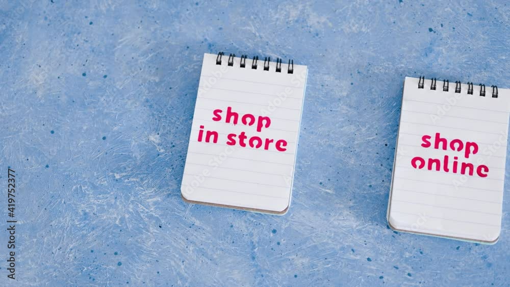 shop in store vs shop online texts on notepads, competition and retail industry shop in store vs shop online texts on notepads, competition and retail industry