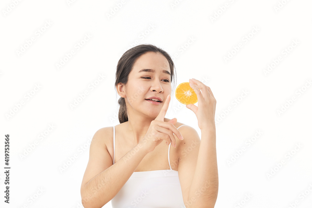 woman with sliced orange on white woman with sliced orange on white
