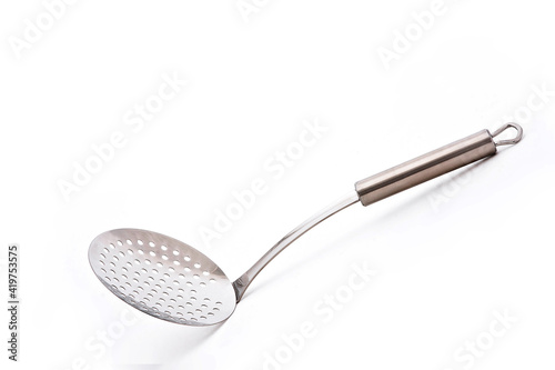Stainless Steel Round Kitchen Skimmer or Skimmer Spoon Isolated on White Background, Skimming Ladle photo