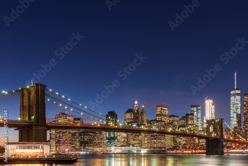 Magic hour view of Manhattan Skyscrapers and Brooklyn bridge in New York  USA
