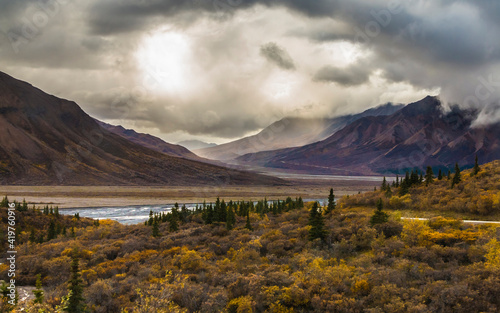 dramatic autumn landscape photo of he mountain peaks and valleys inside the Denali National Park in Alaska © Nathaniel Gonzales