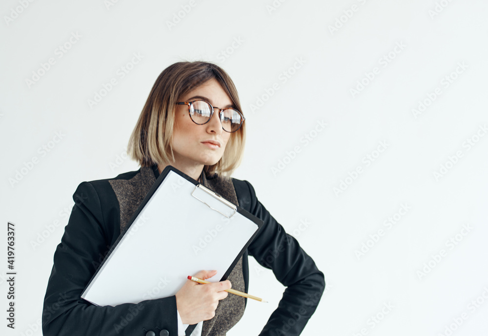 Woman download with documents in hands on a light background Woman download with documents in hands on a light background