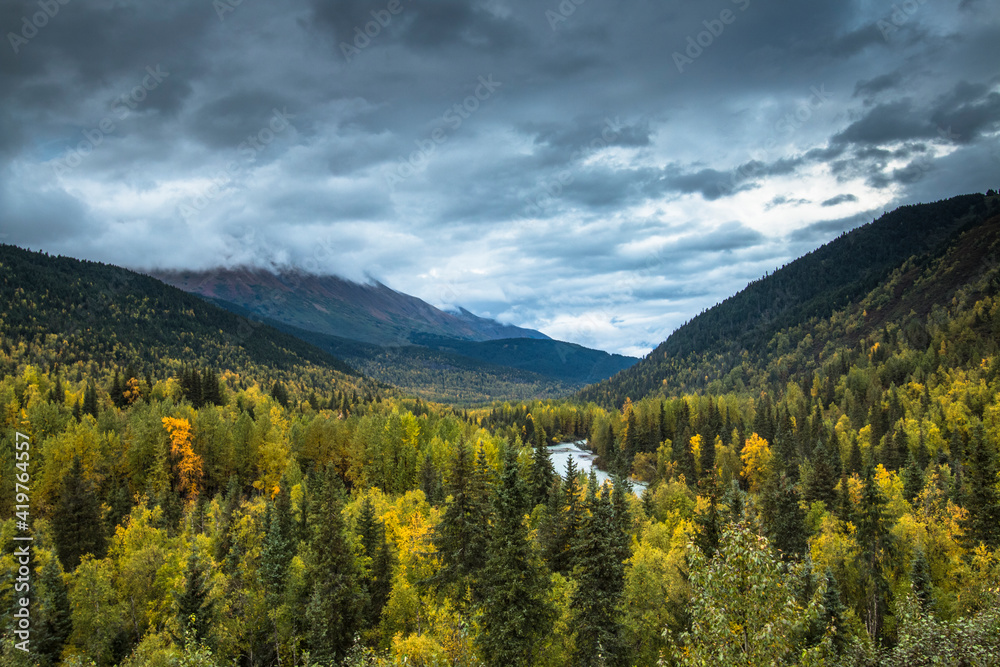 Obraz premium dramatic autumn landscape photo of mountain peaks and calm lakes in the Kenai Peninsula in Alaska .