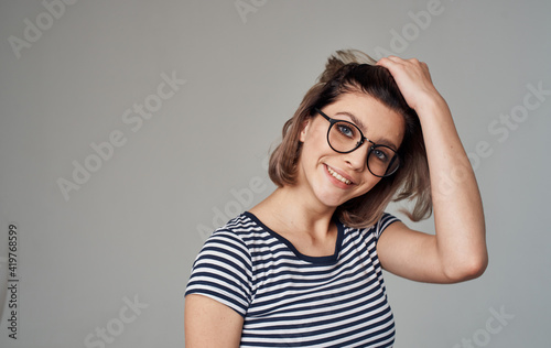 woman in striped t-shirt emotion smile glasses model