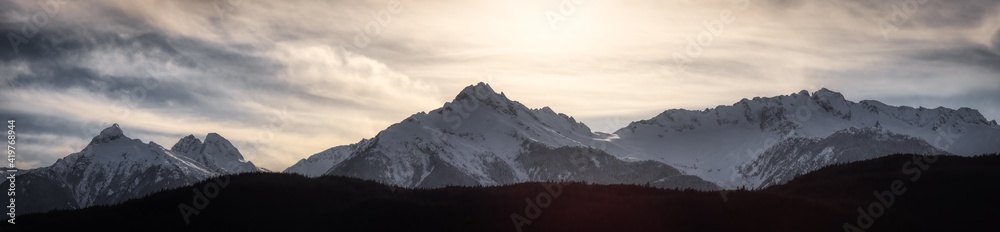 Panoramic Canadian Mountain Landscape View during a cloudy winter day. Taken in Tantalus Lookout near Squamish and Whistler, North of Vancouver, BC, Canada. Background Panorama