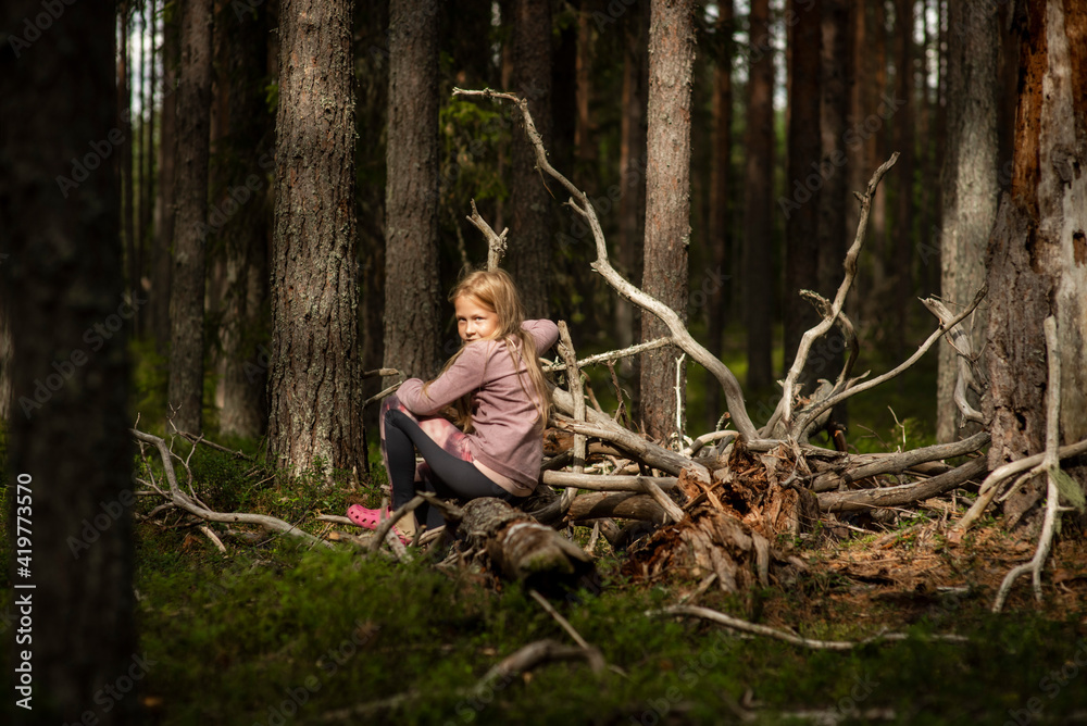 10-year-old girl in the woods, selective focus 10-year-old girl in the woods, selective focus