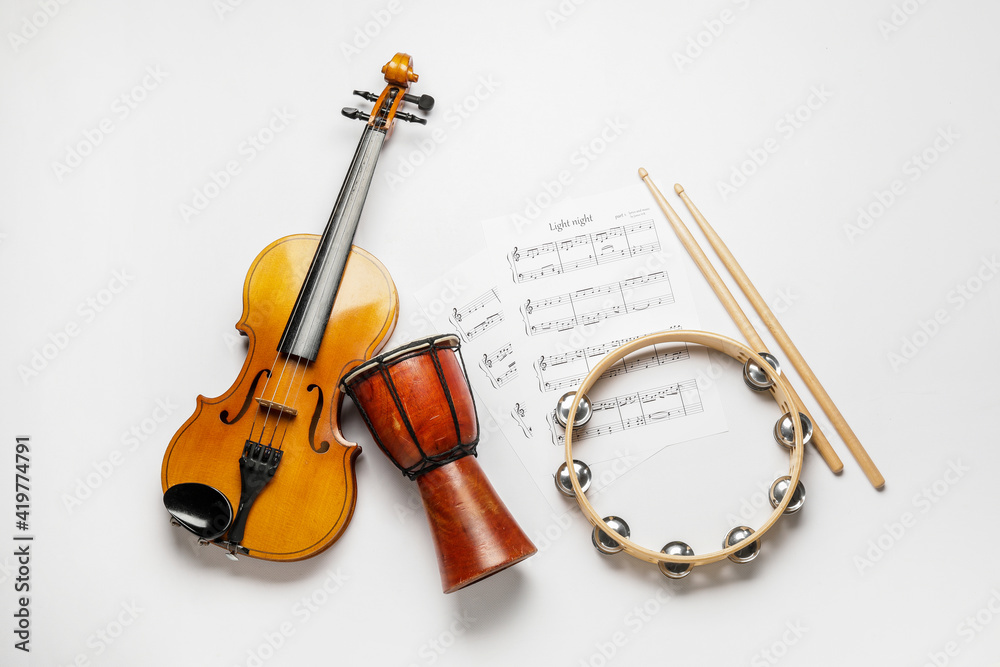 Fototapeta premium Different musical instruments and music notes on white background