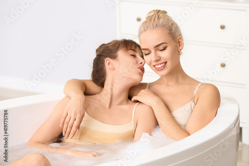 Happy lesbian couple taking...